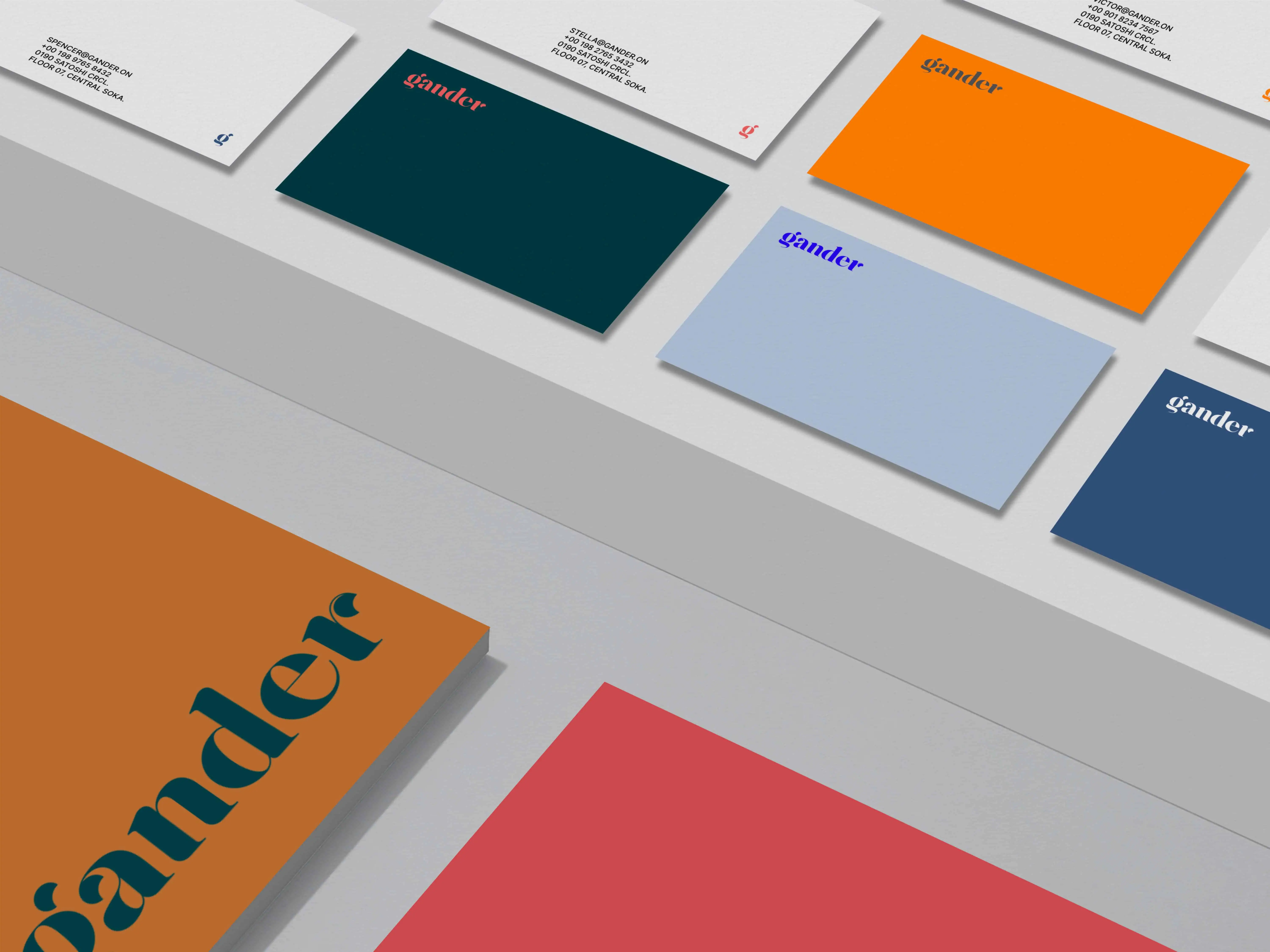 Business cards and stationery featuring the Gander logo in various bold colors.