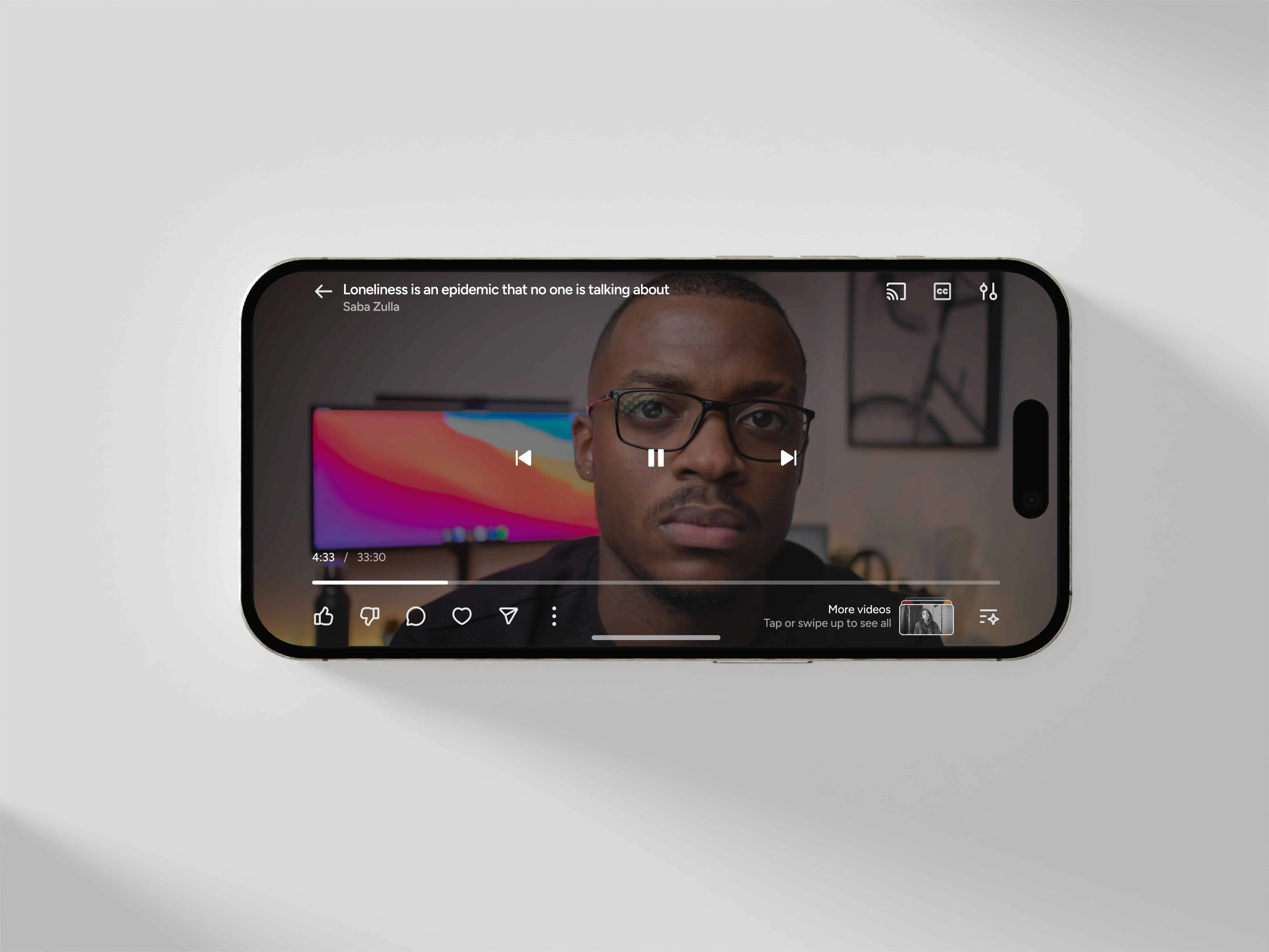 iPhone 16 displaying a paused video titled "Loneliness is an epidemic that no one is talking about" on the Gander app.
